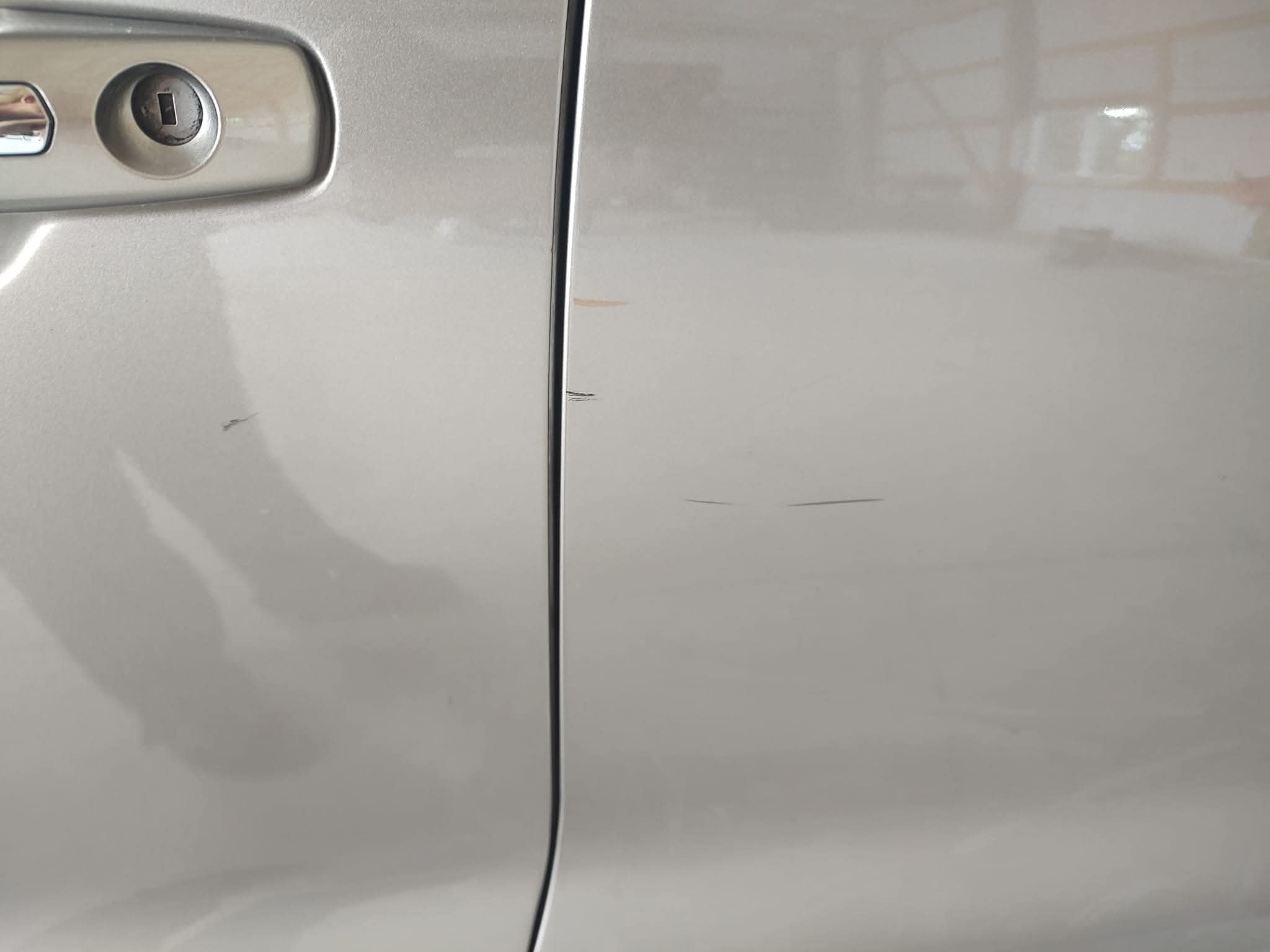 Car paint with swirl marks and scratches
